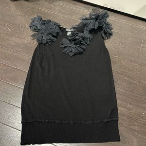 Black DKNY tank top with flower embellishments.